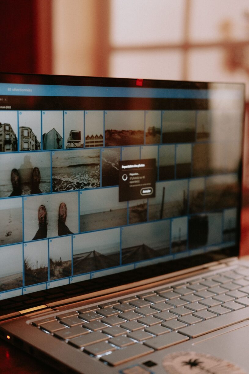 Laptop screen showing photo editing software used to compress and optimize website images